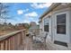 Wooden deck furnished with chairs, offering a pleasant outdoor seating area and backyard view at 210 Meadow View Dr, Grayson, GA 30017