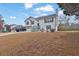 Charming two-story home with white siding, red shutters, and a two-car garage at 210 Meadow View Dr, Grayson, GA 30017