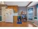 Bright kitchen boasting checkered wallpaper, and access to the back door at 210 Meadow View Dr, Grayson, GA 30017