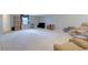 Expansive living room showcasing neutral carpet, media center and comfortable seating area at 210 Meadow View Dr, Grayson, GA 30017