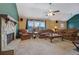 Comfortable living room featuring a fireplace, stone hearth, and two sofas and a chair at 210 Meadow View Dr, Grayson, GA 30017
