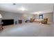 Spacious living room with neutral carpet, multiple seating areas and television at 210 Meadow View Dr, Grayson, GA 30017