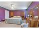 Spacious main bedroom with carpeted floors and lots of wooden furniture at 210 Meadow View Dr, Grayson, GA 30017