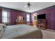 Spacious main bedroom with carpeted floors and lots of wooden furniture at 210 Meadow View Dr, Grayson, GA 30017