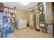Utility room features a hot water heater, freezer, and shelving for storage at 210 Meadow View Dr, Grayson, GA 30017