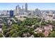 An aerial view of the community and cityscape, surrounded by green foliage at 220 Renaissance Ne Pkwy # 1105, Atlanta, GA 30308