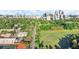 Scenic aerial view of an Atlanta park including sports fields, road, track, and cityscape under a blue, cloudy sky at 220 Renaissance Ne Pkwy # 1105, Atlanta, GA 30308