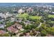An aerial view shows the complex surrounded by greenspace and community pool and recreational areas at 220 Renaissance Ne Pkwy # 1105, Atlanta, GA 30308