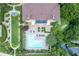 Aerial view of a condo community, featuring a pool, lawn, and manicured grounds at 220 Renaissance Ne Pkwy # 1105, Atlanta, GA 30308