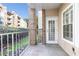 Private balcony with brick columns overlooking community landscape and building at 220 Renaissance Ne Pkwy # 1105, Atlanta, GA 30308