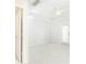 Bright, airy bedroom features a ceiling fan and a door leading to a balcony at 220 Renaissance Ne Pkwy # 1105, Atlanta, GA 30308
