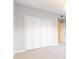 Bedroom with plush carpeting and a closet with folding doors for ample storage at 220 Renaissance Ne Pkwy # 1105, Atlanta, GA 30308