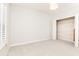 Bright and airy bedroom featuring plush carpet, a large closet, and natural light at 220 Renaissance Ne Pkwy # 1105, Atlanta, GA 30308