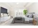 Beautiful bedroom features a ceiling fan, large windows, and a modern décor at 220 Renaissance Ne Pkwy # 1105, Atlanta, GA 30308