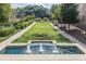 Manicured community grounds showcase a fountain, a green lawn, and walking paths at 220 Renaissance Ne Pkwy # 1105, Atlanta, GA 30308
