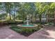 Beautiful courtyard featuring a multi-tiered water fountain, manicured landscaping, and seating at 220 Renaissance Ne Pkwy # 1105, Atlanta, GA 30308