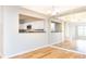 Dining area with hardwood floors, chandelier, and mirrors reflecting the kitchen at 220 Renaissance Ne Pkwy # 1105, Atlanta, GA 30308