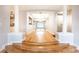 Dining room with hardwood floors, pillars, and a view of the kitchen at 220 Renaissance Ne Pkwy # 1105, Atlanta, GA 30308