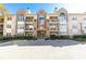 Exterior view of a multi-story apartment complex with brick accents, balconies, and manicured landscaping at 220 Renaissance Ne Pkwy # 1105, Atlanta, GA 30308