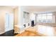 Open floor plan with hardwood floors, built-in shelves, fireplace, and plenty of natural light from large windows at 220 Renaissance Ne Pkwy # 1105, Atlanta, GA 30308