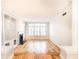 Bright living room with hardwood floors, fireplace, built-in shelving, and large windows with shutters at 220 Renaissance Ne Pkwy # 1105, Atlanta, GA 30308