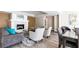 Cozy lounge area with a fireplace, comfortable seating, stylish decor, and wood floors at 220 Renaissance Ne Pkwy # 1105, Atlanta, GA 30308