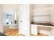 A functional office nook features built in shelving and cabinets, and a dark counter top at 220 Renaissance Ne Pkwy # 1105, Atlanta, GA 30308