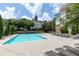 Outdoor pool with lounge chairs and well-maintained landscaping and building views at 220 Renaissance Ne Pkwy # 1105, Atlanta, GA 30308
