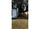 A backyard with a wooden fence and dense trees, offering a private and natural setting at 4778 Pebble Trce, Buford, GA 30518