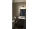Bathroom with vanity, tile floors, toilet, and overhead lighting at 4778 Pebble Trce, Buford, GA 30518