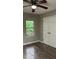 Bedroom featuring a double closet and window view at 4778 Pebble Trce, Buford, GA 30518