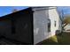 Exterior shot showcasing the siding of the house and green lawn at 4778 Pebble Trce, Buford, GA 30518