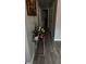 Hallway with hard surface floors and modern decor at 4778 Pebble Trce, Buford, GA 30518