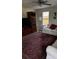 Comfortable living room featuring wood floors, a decorative ceiling fan, couches and a large rug at 4778 Pebble Trce, Buford, GA 30518