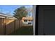 Side yard featuring a wooden fence and grassy area, providing a private outdoor space at 4778 Pebble Trce, Buford, GA 30518