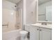 Well-lit bathroom with a shower-tub combo and a white vanity with modern fixtures at 11111 Shannon Cir, Hampton, GA 30228