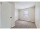 This is a bedroom with carpet, a window and a closet at 11111 Shannon Cir, Hampton, GA 30228