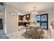 Bright dining area with wooden table, stylish chairs, and sliding glass doors for natural light at 11111 Shannon Cir, Hampton, GA 30228