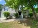 Charming two-story home featuring gray siding, black shutters, and a well-maintained front yard at 11111 Shannon Cir, Hampton, GA 30228