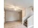 A large living room with stairs, a door to outside and tile flooring at 11111 Shannon Cir, Hampton, GA 30228