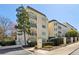 Charming multi-story condo building with elegant black iron balconies and manicured landscaping at 3638 Peachtree Rd # 306, Atlanta, GA 30319