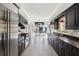 Modern kitchen featuring black cabinets, stainless steel appliances, and an eat-in nook with natural light at 3638 Peachtree Rd # 306, Atlanta, GA 30319