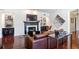 Bright living room showcasing a fireplace, hardwood floors, and sophisticated decor at 3638 Peachtree Rd # 306, Atlanta, GA 30319