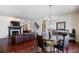 Open-concept living space with a fireplace, dining area, and hardwood floors at 3638 Peachtree Rd # 306, Atlanta, GA 30319