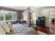 This bedroom features a comfortable bed, desk area, and rich wood floors at 3638 Peachtree Rd # 306, Atlanta, GA 30319