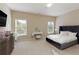 Bright bedroom with a bed, a TV, a vanity and two windows at 1760 Grand Oaks Drive, Woodstock, GA 30188