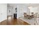 Elegant dining room featuring a chandelier, hardwood floors, and ample natural light at 1760 Grand Oaks Drive, Woodstock, GA 30188