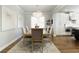 Stylish dining area with a modern chandelier and seamless flow into the kitchen at 1760 Grand Oaks Drive, Woodstock, GA 30188