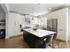 Modern kitchen featuring a large island, stainless steel appliances, and ample cabinet space at 1760 Grand Oaks Drive, Woodstock, GA 30188