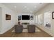 Bright living room featuring wood floors, recessed lights, and comfortable seating near the entertainment center at 1760 Grand Oaks Drive, Woodstock, GA 30188